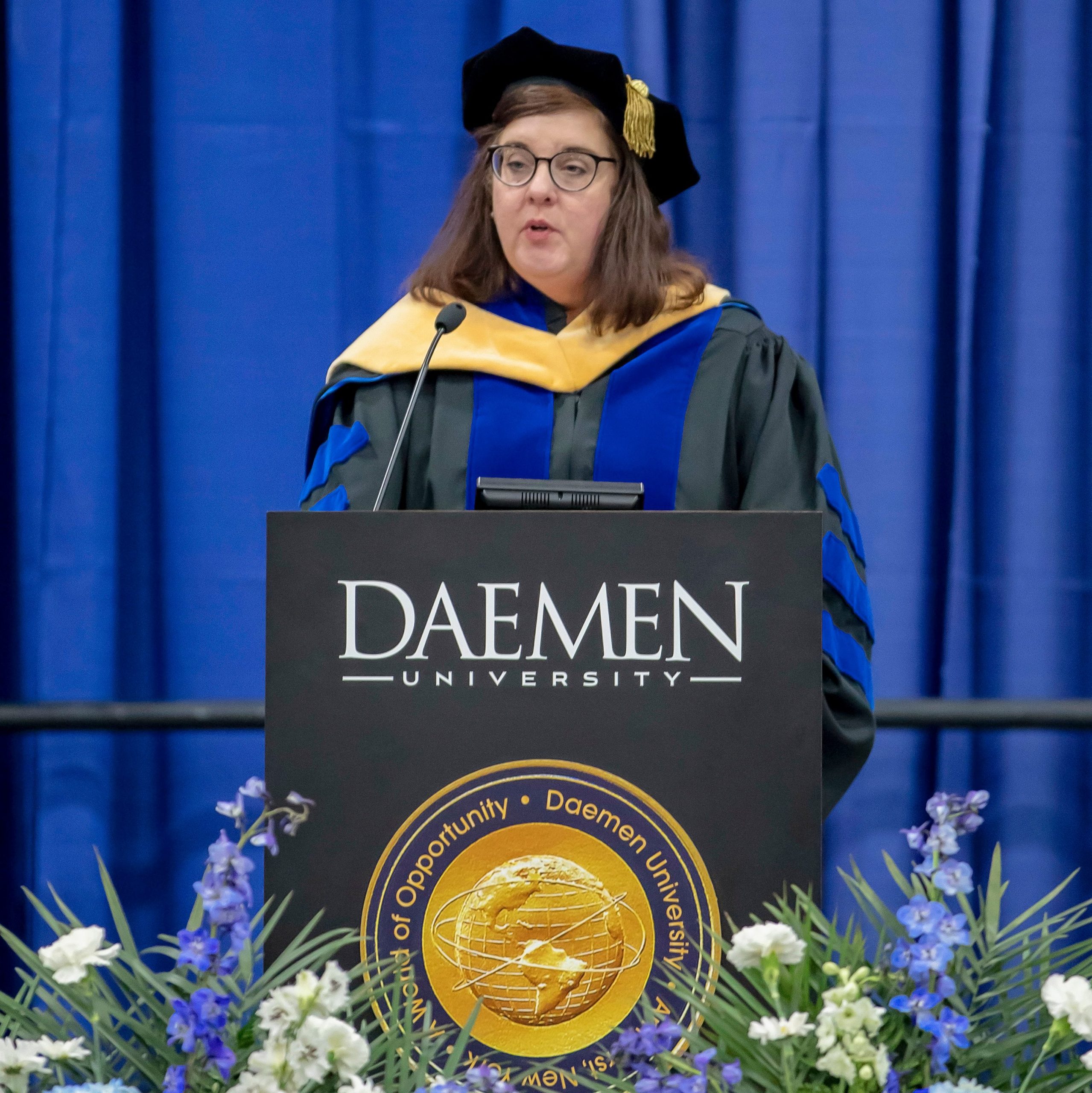 Dr. Lisa Parshall speaking at commencement