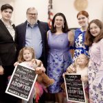 The Marple family post as a large group following the adoption of Llliian and Collette.